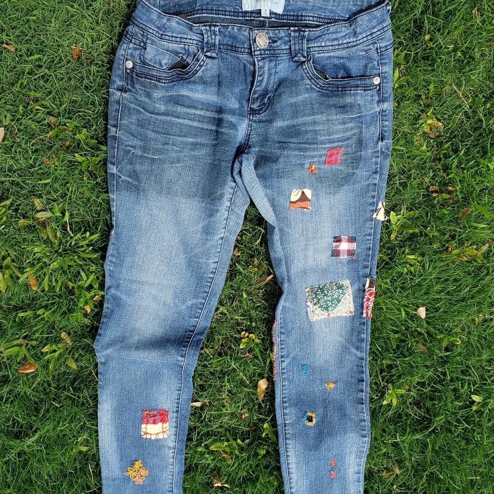 Recycled skinny jeans with hand-stitched detailing